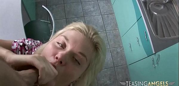  Sexy blonde dances in the kitchen before giving her boyfriend a blowjob